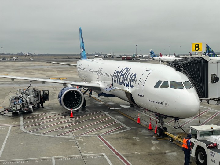 A JetBlue airplane at the airport gate.