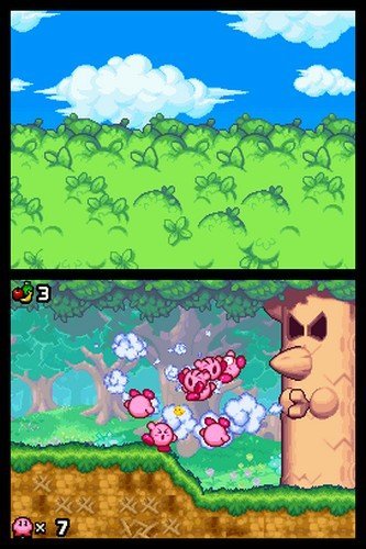A gaggle of Kirbys fight a tree in Kirby Mass Attack.