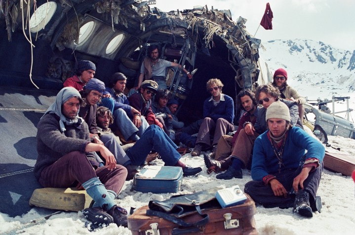 People gather at a crashed plane in Society of the Snow.