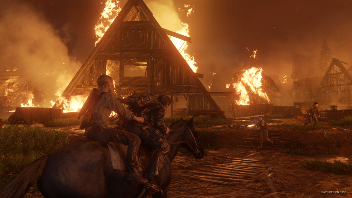 A house burns in The Last of Us Part 2 Remastered.