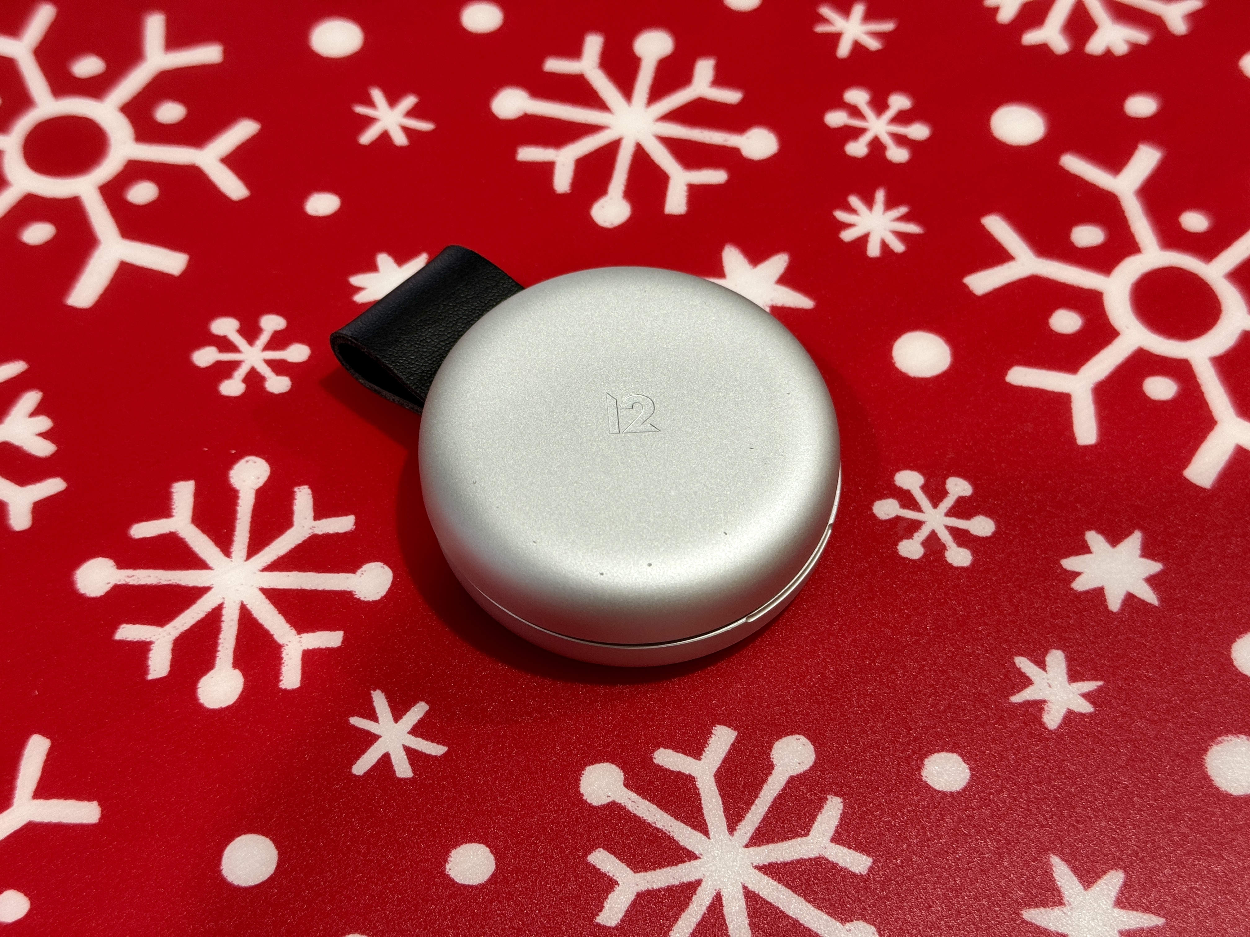Twelve South ButterFly 2-in-1 MagSafe Charger closed on a festive placement.