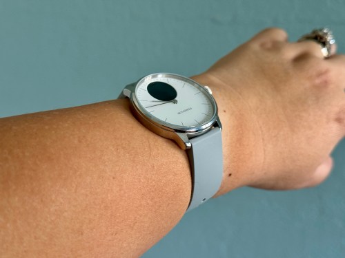 Withings ScanWatch Light being worn on wrist with display off.