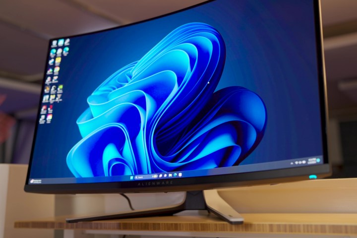 The Alienware 32 QD-OLED monitor on a stand.