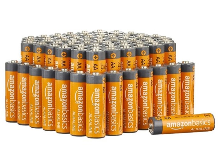 A bunch of Amazon Basics AA batteries on a white background.