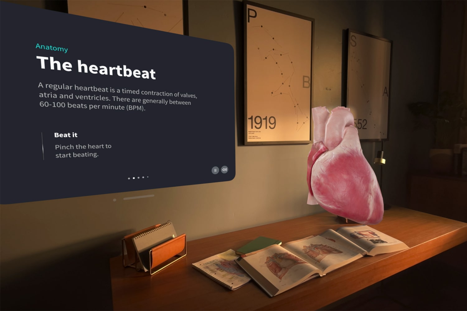 Using the Apple Vision Pro, a human heart appears in augmented reality on a desk, while a text box explaining how it works sits to the side.