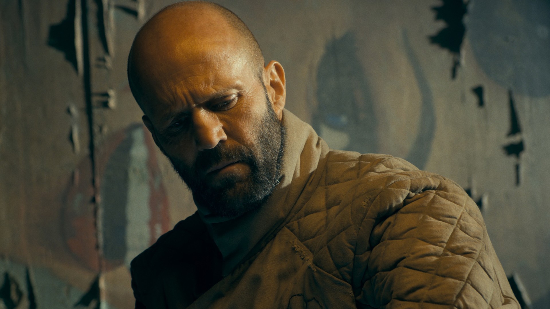 Jason Statham broods in a still from The Beekeeper