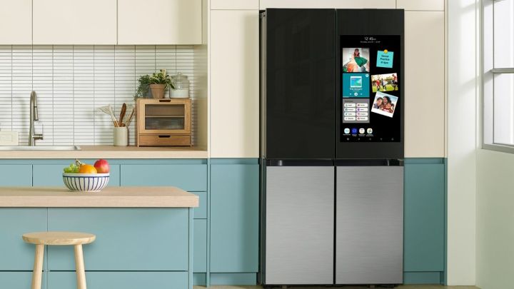 The Samsung Bespoke Smart Fridge next to white and blue cabinets.