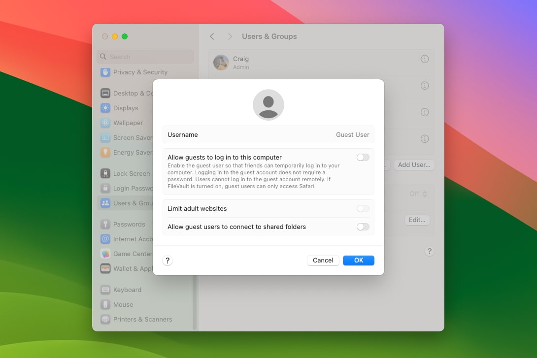 The Settings app in macOS Sonoma showing an option to enable or disable a guest user.