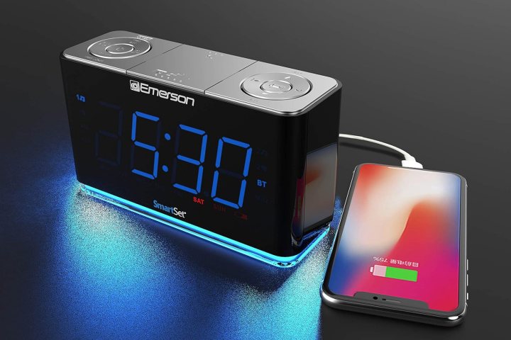 Emerson Smartset Radio Alarm Clock charging a smartphone