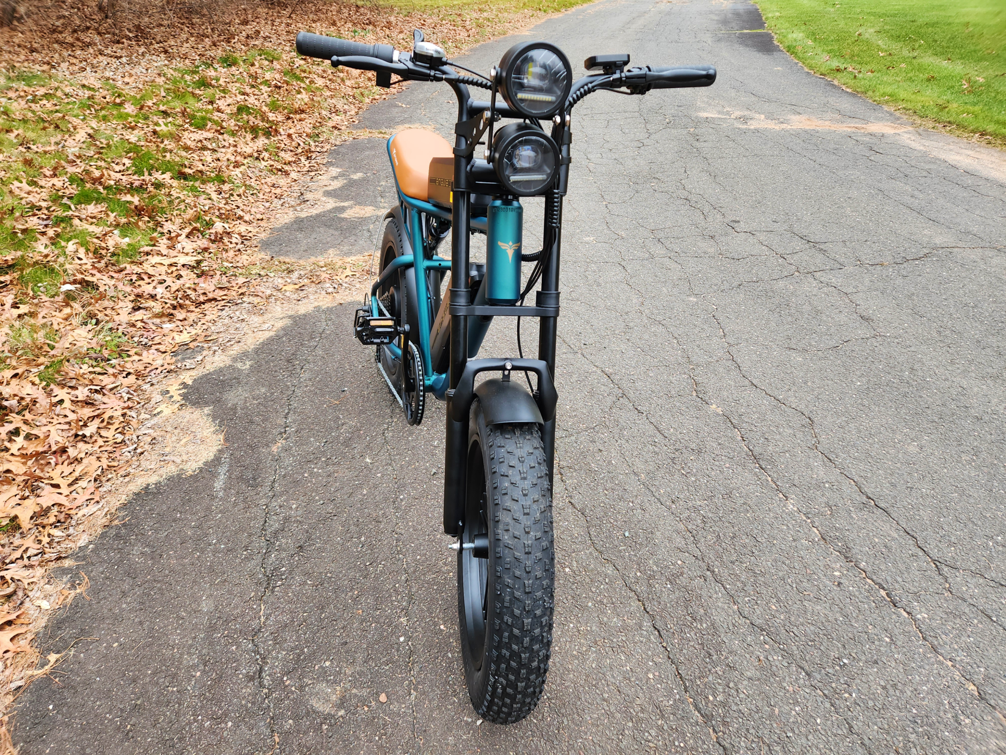 Engwe M20 e-bike has dual vertical headlamps and knobby fat tires.