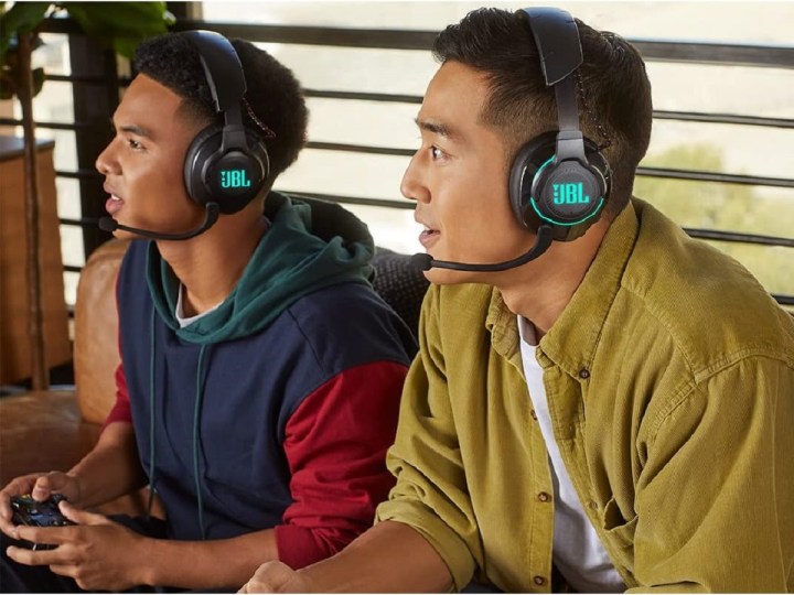 Two guys wearing the JBL Quantum 810 wireless gaming headset.