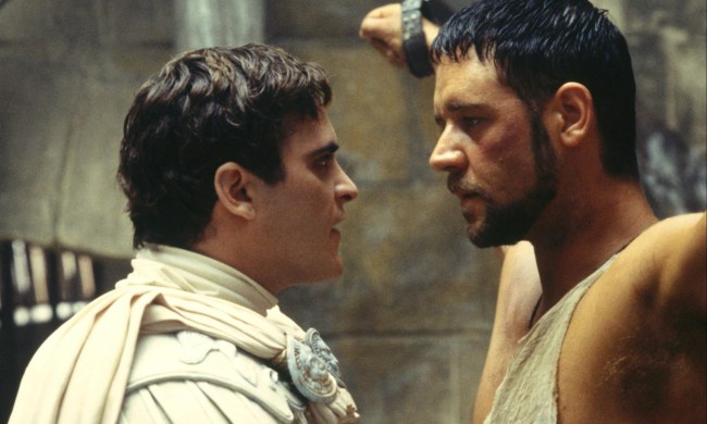 Joaquin Phoenix stares into Russell Crowe's eyes as the latter is chained.