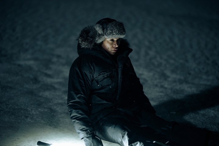 Kali Reis kneels in the snow in True Detective: Night Country episode 3.