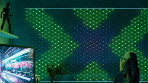 The Twinkly Matrix Smart LED Curtain with green lights.