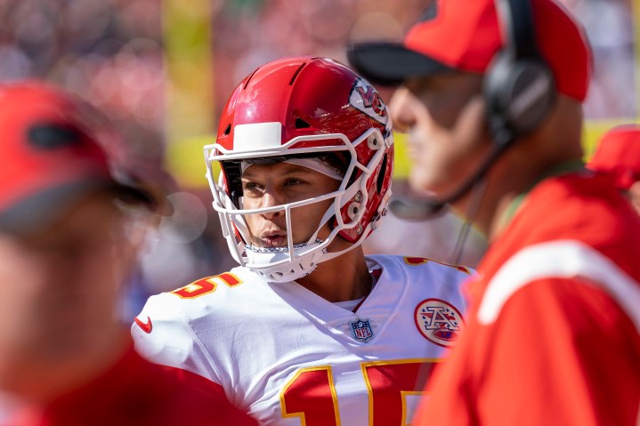 Patrick Mahomes of the Kansas Metropolis Chiefs stares from the sideline.