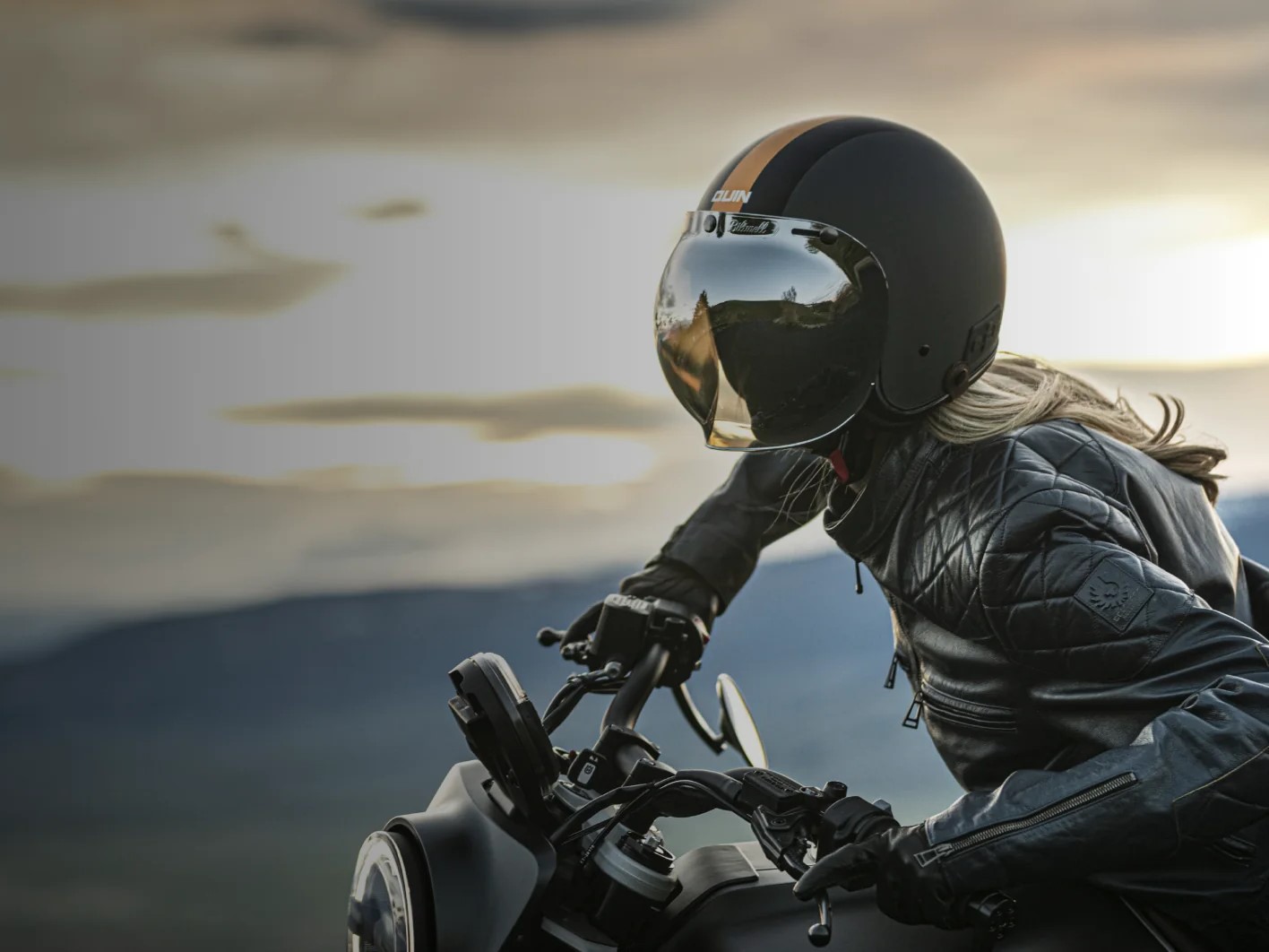 Quin McQ open face smart motorcycle helmet on road