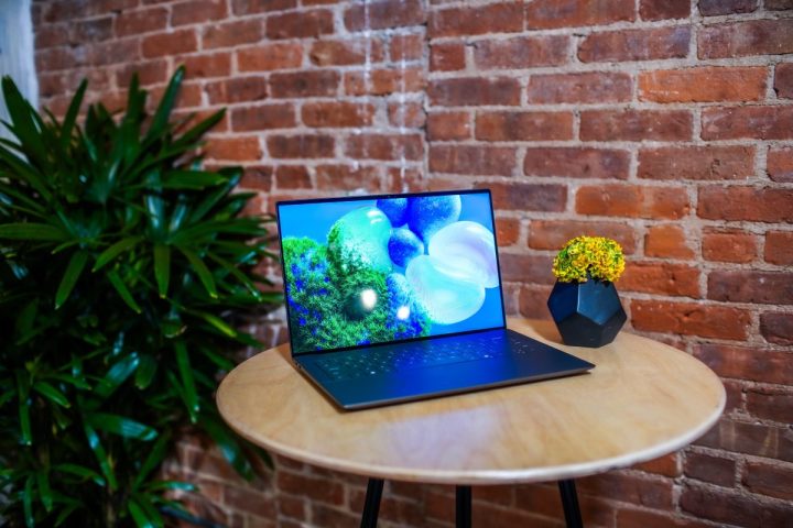 Dell XPS 14 lifestyle view showing laptop on coffee table.