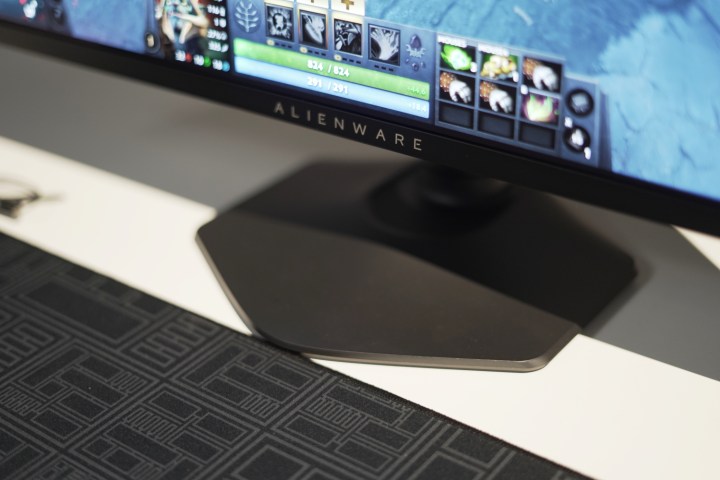 The redesigned base of the Alienware 27 QHD QD-OLED on a table.