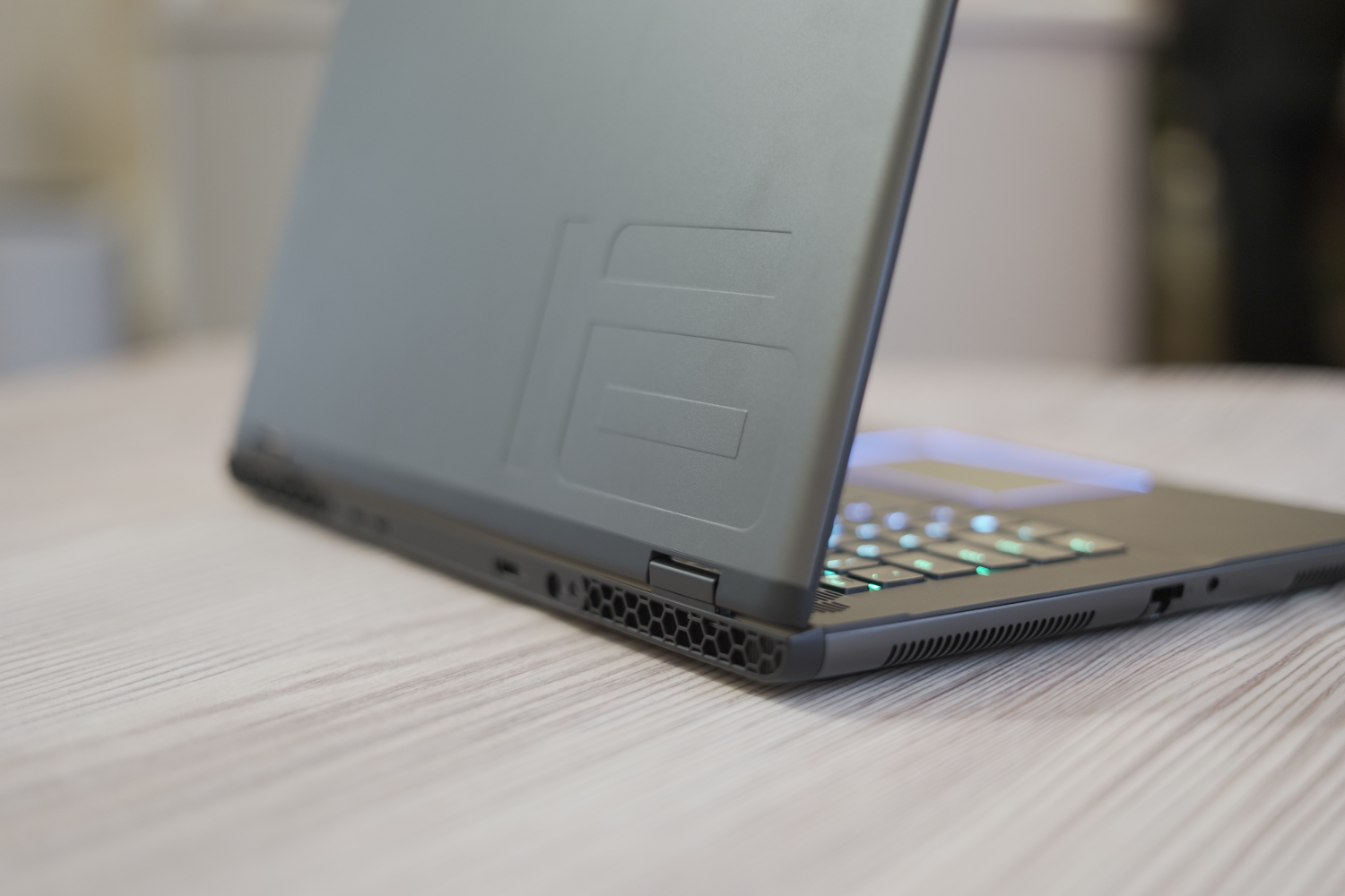 The back of the Alienware m16 R2 on a table.