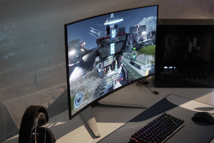 The Alienware 32 4K QD-OLED being played on a white table.