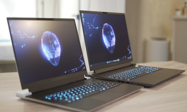 The Alienware x16 and m18 open on a table.