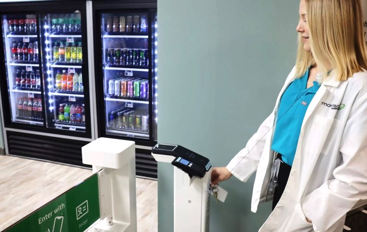A health care worker shopping at a store using Amazon's Just Walk Out technology.