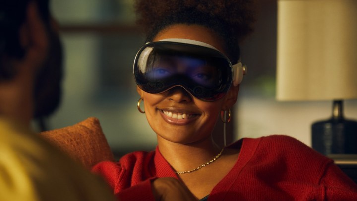 A woman wearing the Apple Vision Pro headset.