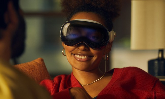 A woman wearing the Apple Vision Pro headset.