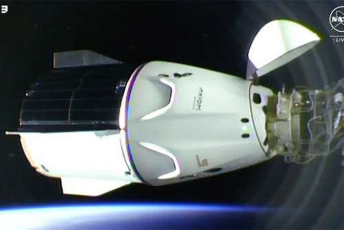 The SpaceX Dragon Freedom spacecraft carrying four Axiom MIssion 3 astronauts is pictured docked to the space station shortly after an orbital sunrise.