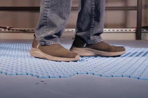 The feet of someone walking on Disney's Holotile technology.