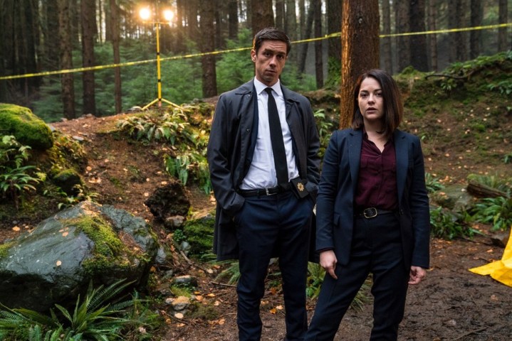 Two people pose in a forest in Dublin Murders.