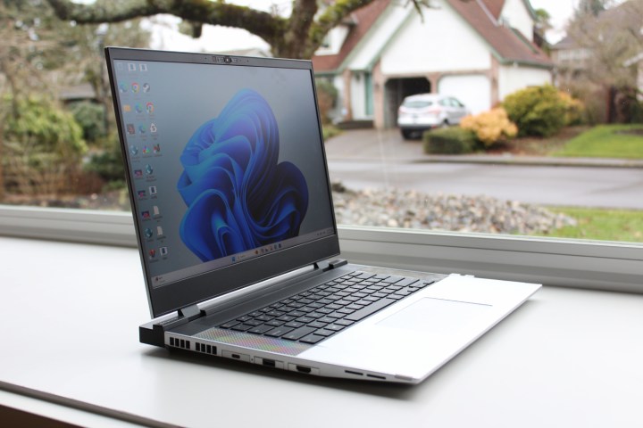 The Framework Laptop 16 in front of a window.