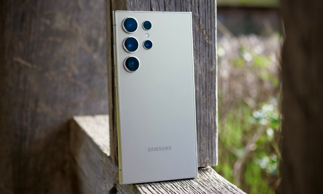 The back of the Samsung Galaxy S24 Ultra, resting against a post.