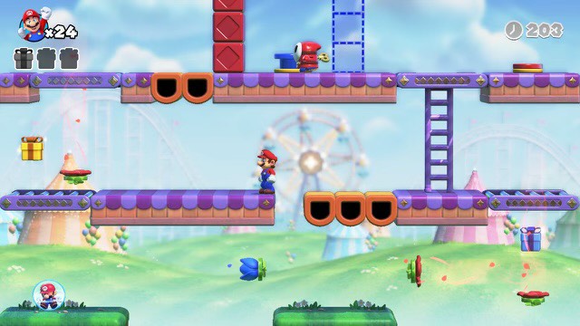 Mario se tient sur une scène dans Mario contre Donkey Kong.