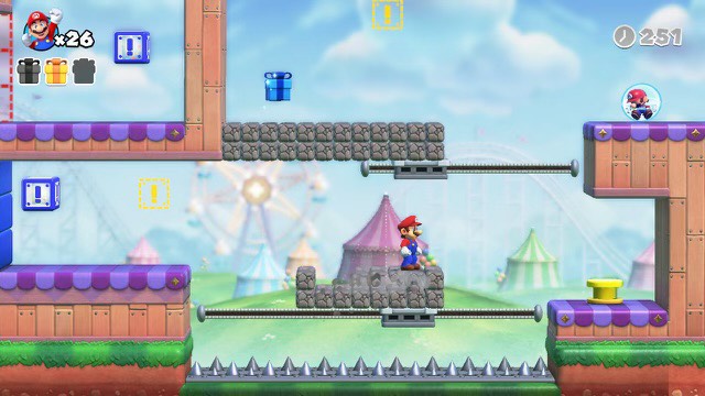 Mario se tient sur des chutes de pierres dans Mario contre Donkey Kong.