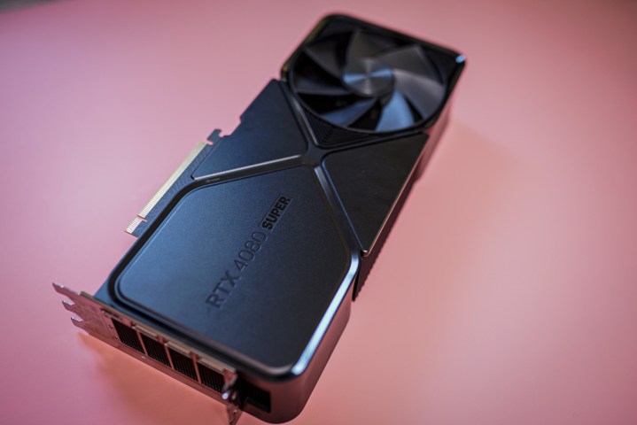 The RTX 4080 Super graphics card sitting on a pink background.