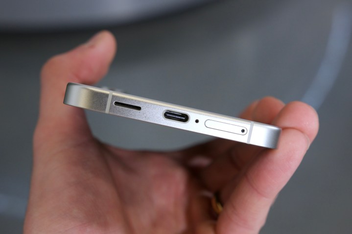 Someone holding the Samsung Galaxy S24 Plus and showing the USB-C port.