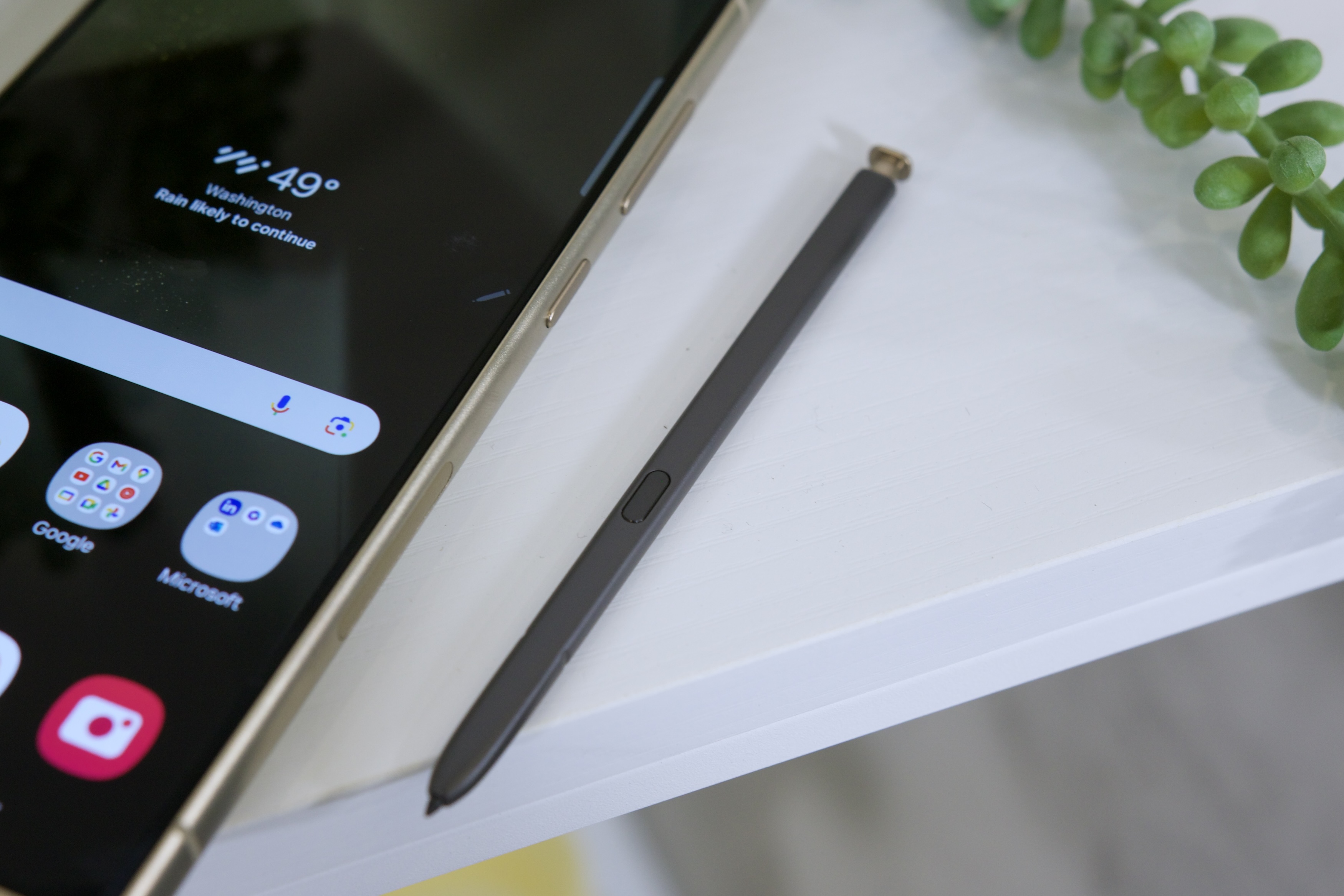 A close-up view of the S Pen next to the Samsung Galaxy S24 Ultra.