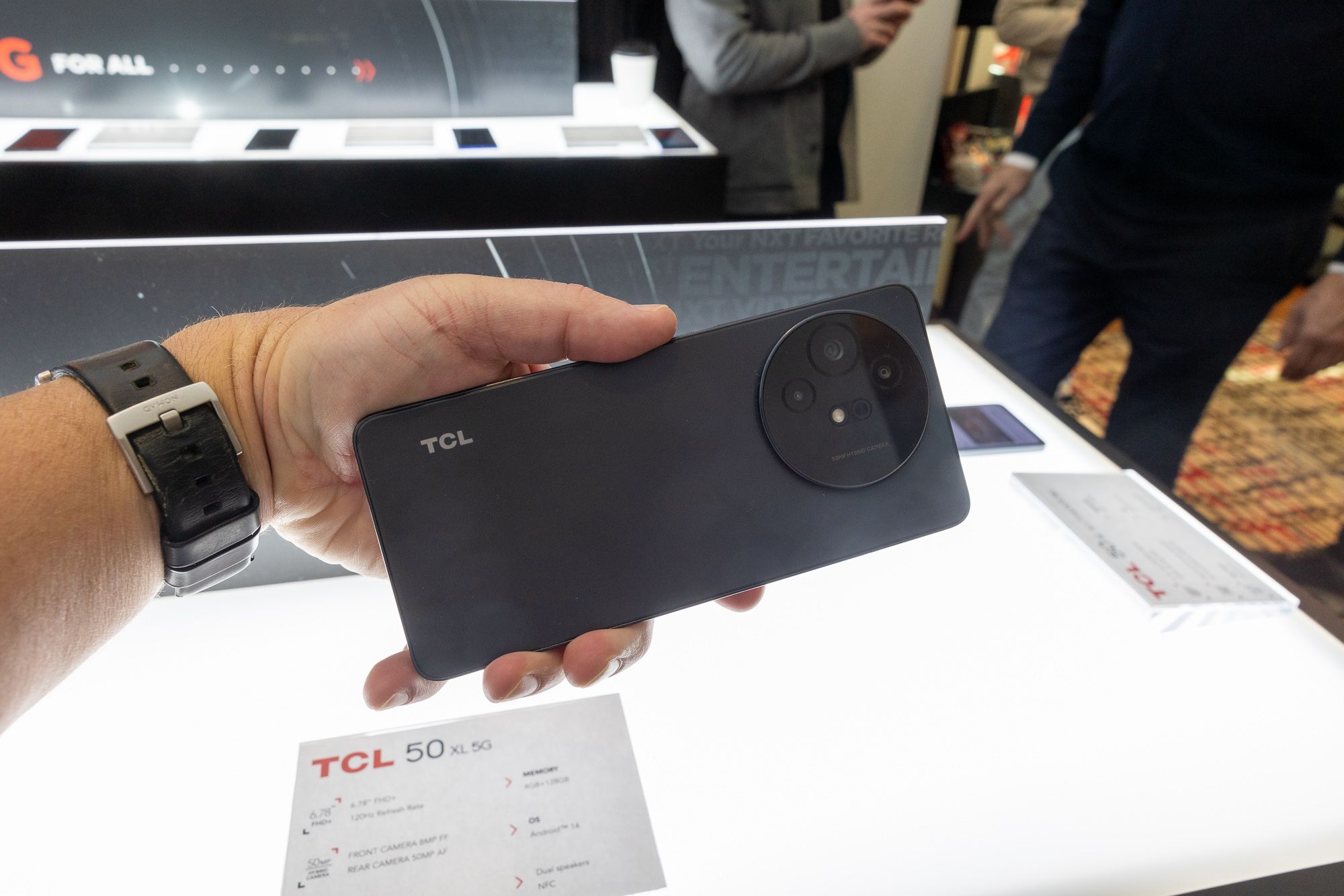 Someone holding the TCL 50 XL 5G at CES 2024.
