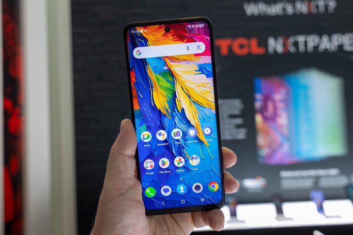 Someone holding the TCL 50 XL NxtPaper 5G smartphone at CES.