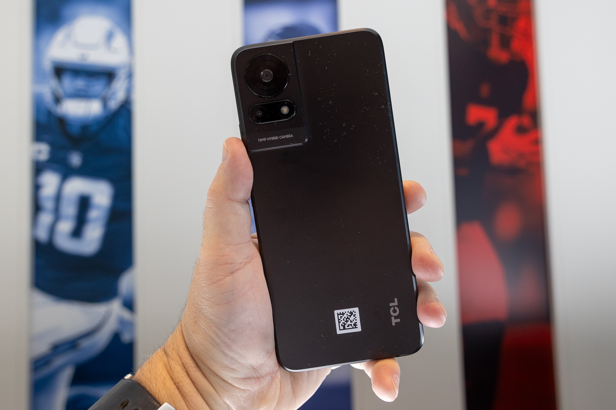 Someone holding the TCL 50 LE smartphone at CES 2024.