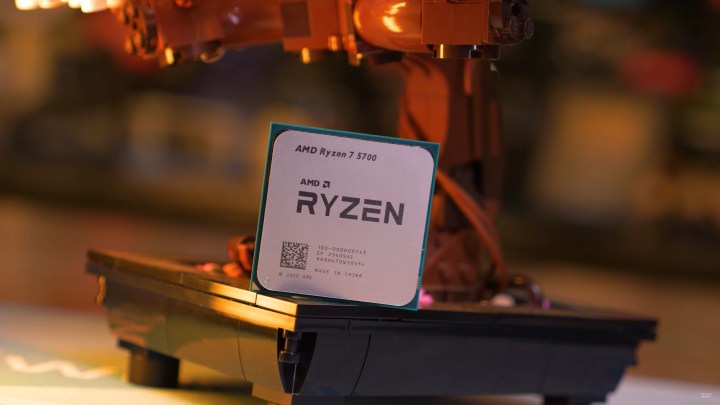 The AMD Ryzen 7 5700 propped up against an action figure.