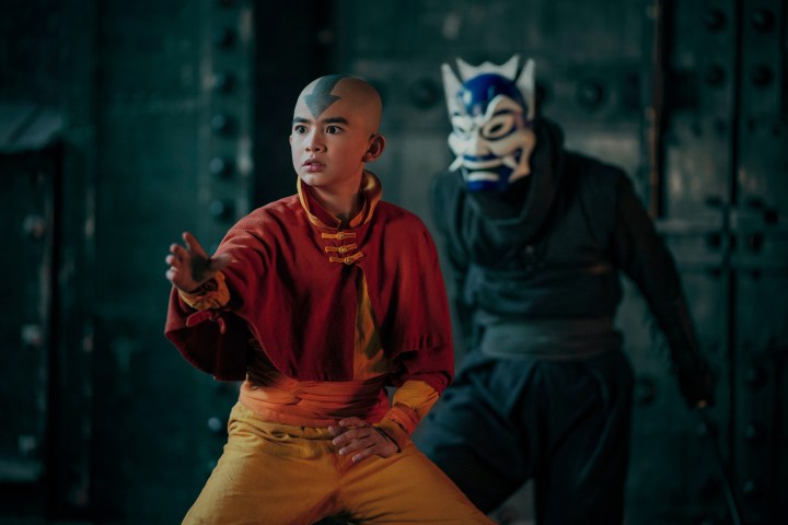 Aang stands in front of a masked Zuko in Avatar: The Last Airbender.