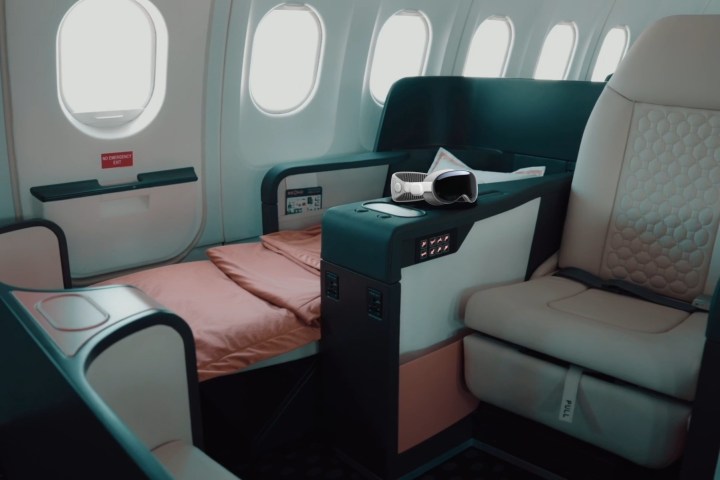 An Apple Vision Pro is superimposed over a photo of Beond airlines luxury accommodation.