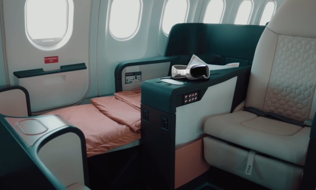 An Apple Vision Pro superimposed over a photo of a Beond airlines luxury accommodation.