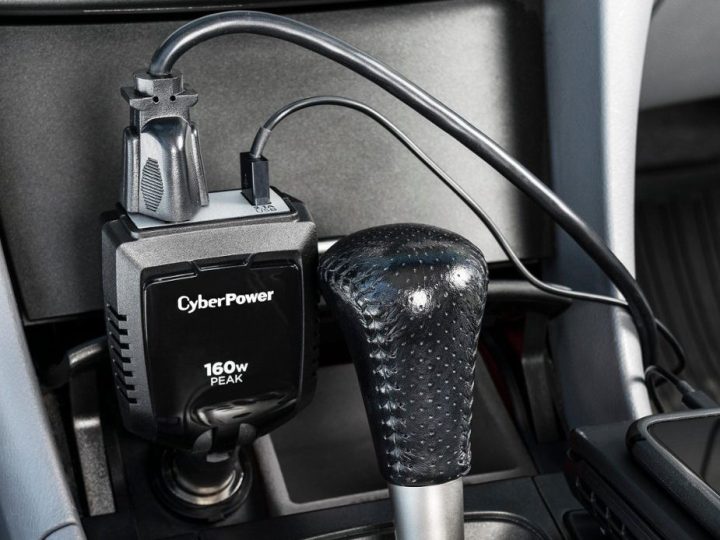 The CyberPower 160W power inverter, plugged into a car's cigarette lighter.
