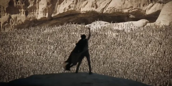 A man stands in front of a crowd in Dune: Part Two.