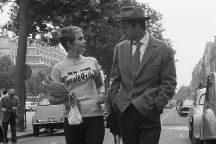 Jean Seberg and Jean-Paul Belmondo walking along a street in Breathless (1960).