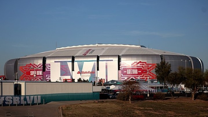 The sun sets on the Super Bowl stadium.