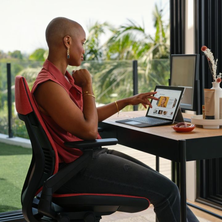 A person sitting in the Steelcase Gesture chair.